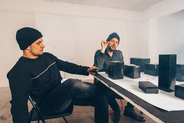 Robbers smoking cigarettes in isolated room
