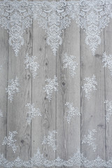 The texture of lace on wooden background