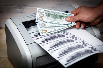 printed dollars. home printer. concept, crime, fake money