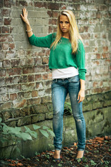 Attractive blond girl posing in the park