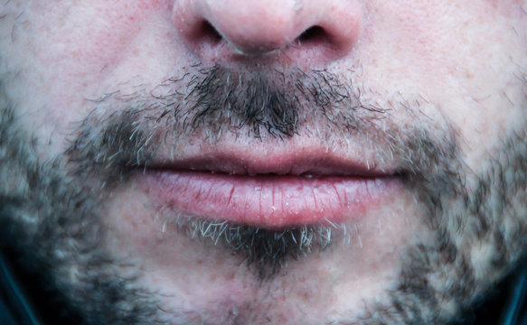 Beautiful Thin Men's Lips And Light Unshaven Face Close Up