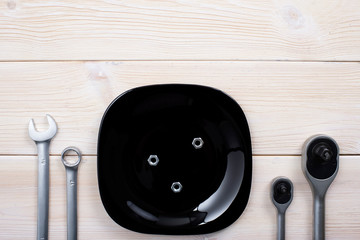 Spanners on wooden white background. Table setting.