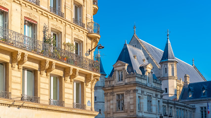 Paris, beautiful building, typical parisian facade in the Marais, with the Saint-Martin-des-Champs church rue Reaumur