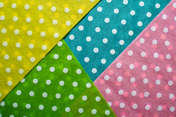 Multi Coloured background on dots. Geometric background on points.