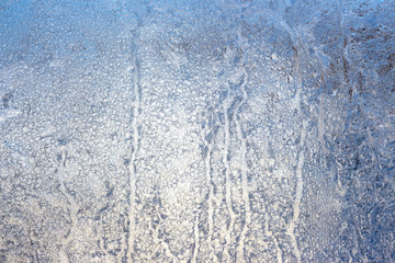 Fototapeta na wymiar frosty patterns on the winter window