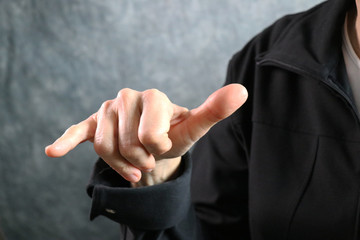 American Sign Language (ASL) letter Y held in correct position next to body