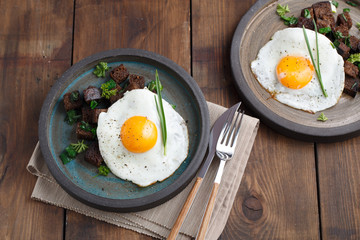 Fried Egg on Wholegrain Toast croutons, top view, copy space