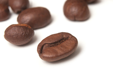 closeup of coffee beans on white background