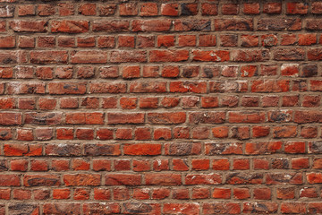 Texture old brick wall, toned photo, darkening in corners