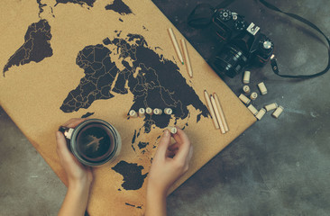 top view travel concept with world map and camera and on black background with copy space