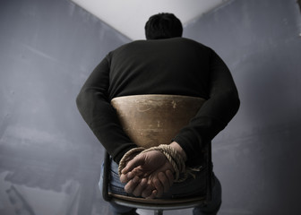 Hands tied up with rope