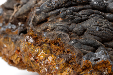 Macro mineral Hematite stone on a white background close-up