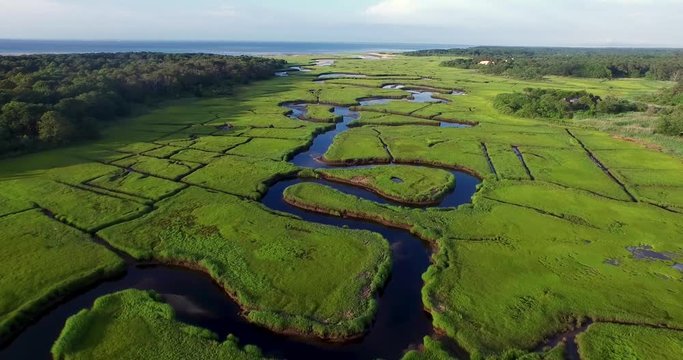 Aerial footage of a winding coastal river in new england