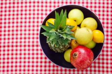 bowl on a table with fruit.-image