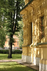 facade of a yellow building in summer