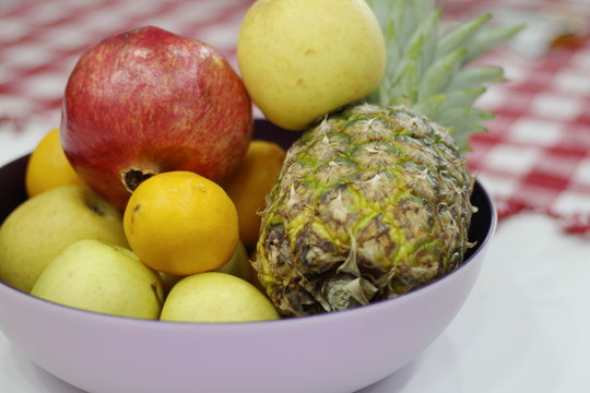 bowl on a table with fruit.-image