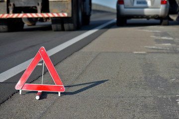 Closeup of warning triangle on roadside