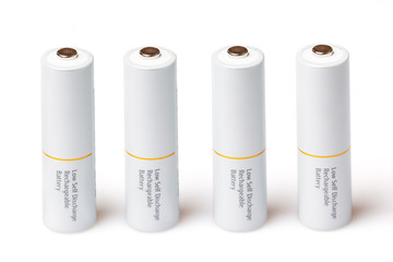AA batteries are close to each other. Close-up of white batteries on a white background. Battery...