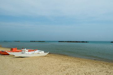 Fototapeta na wymiar Lifeboats on San Benedetto del Tronto Beach, Adriatic Sea, Ascoli Piceno, Italy