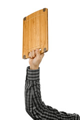 Conceptual picture of the chef. Hand holds cutting board isolated on white background. Chef equipment. Chef equipment. Man hand isolated on white.  Free copy space for text or logo. Kitchen utensils