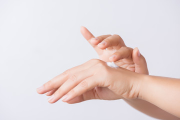 Healthcare concept. Closeup shot of  young woman hands applying moisturizing hand cream.