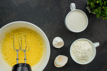 raw dough (eggs, flour and other ingredients). food background. copy space