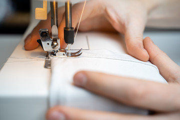 Closeup the sewing machine and item of clothing