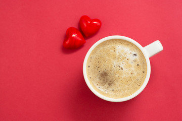 Good morning with hot coffee, lattee, capuccino drink ored background with red heart for your love, valentine's day concept. Copy space.