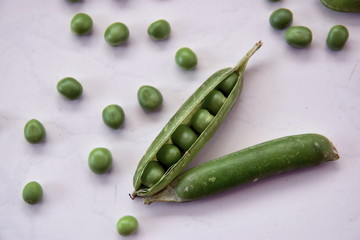 Fresh green peas on the table
