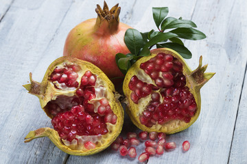 Ripe pomegranate fruit, opened with red seeds