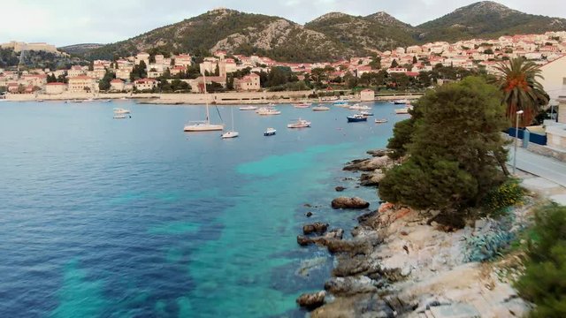 View at the city of Hvar at the island of Hvar from the sea, aerial footage.
