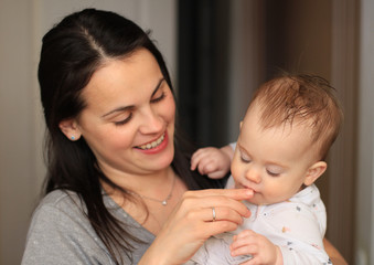 smiling beautiful mother with her baby