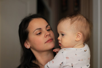 smiling beautiful mother with her baby