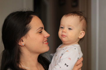 smiling beautiful mother with her baby