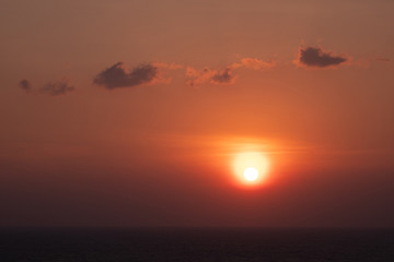 Scenic orange sunset sky background, scenic orange sunrise, relaxing seascape with wide horizon.