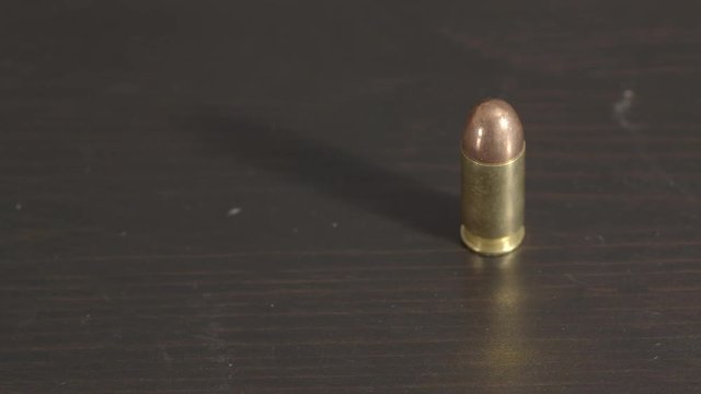 Single .45 ACP cartridge lined out on right side of frame