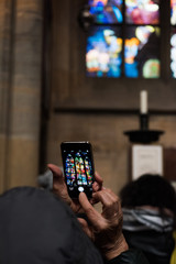 A mobile phone takes a picture in a churche 