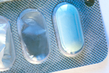 blue pill in the started packaging, macro, toned