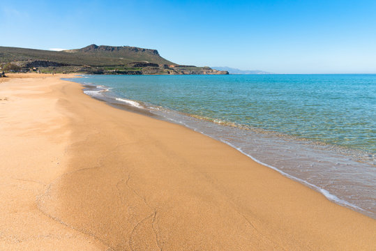 Panoramic view of long sand beach at Arina Sand coast Heraklion Crete Greece. Turquoise water, blue sky mediterranean tropical destination.  Travel holiday concept.