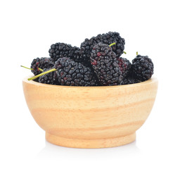 Morus (mulberry) in wooden bowl on white background