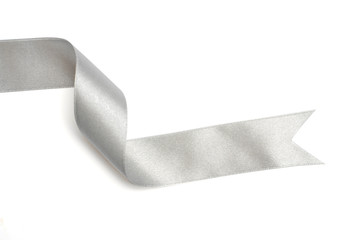 Silver ribbon in roll on white