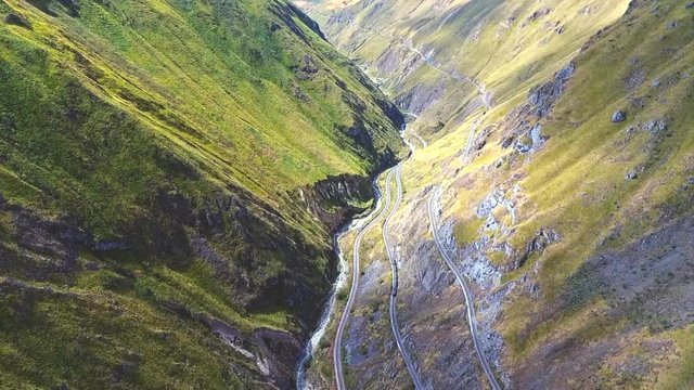An aerial shot of a train going around the "Nariz del Diablo" or  Devil's Nose in Alaus&radic;&ne;, Chimborazo Province, Ecuador. The Devil's Nose is one of the world's most picturesque and dangerous railways.