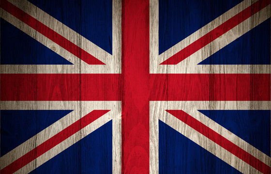 Faded United Kingdom or Great Britain Flag on a wood boards textured background.