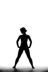 Fototapeta na wymiar full body silhouette shot of a beautiful girl standing and posing