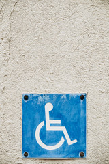 Symbole de handicap, pictogramme bleu et blanc