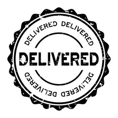 Grunge black delivered word round rubber seal stamp on white background