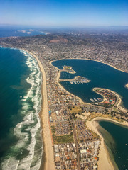 Vibrant, High Altitude Aerial Photo of the Coast of San Diego, California - with a View of the Ocean, Beach, City and Bay on a Bright, Clear, Sunny Day - obrazy, fototapety, plakaty