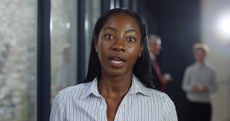 4K Assertive young businesswoman dealing sternly with a problem on video conference call