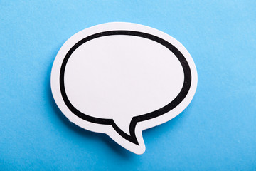 Blank Speech Bubble Isolated On Blue