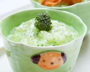 Baby food , Bowl with healthy baby food on table.